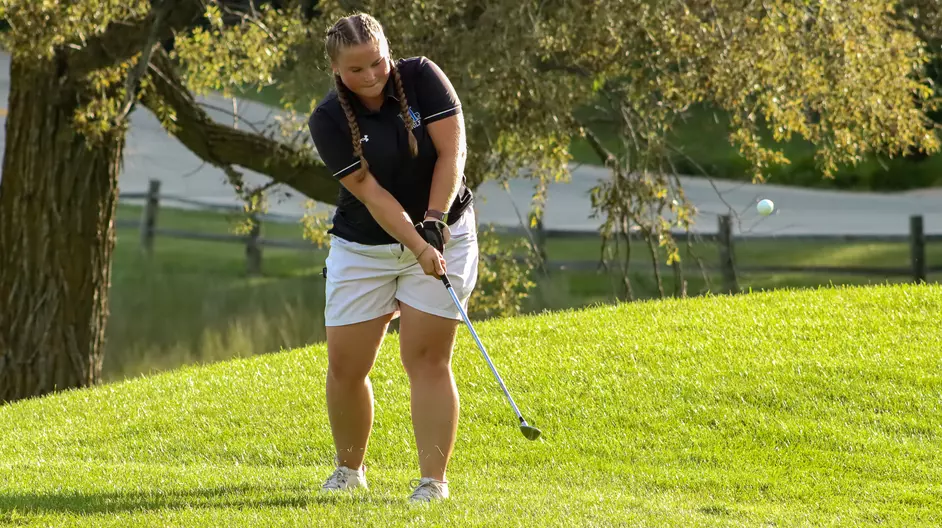 Women playing college golf