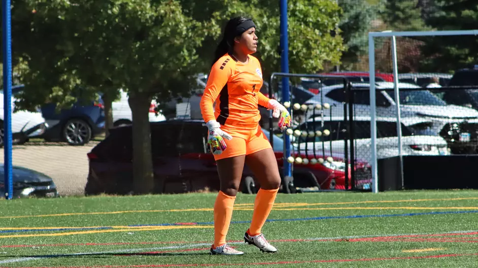 Women playing college soccer