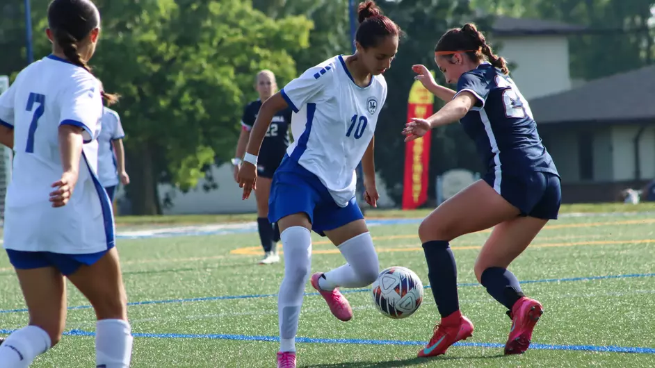 Women playing college soccer