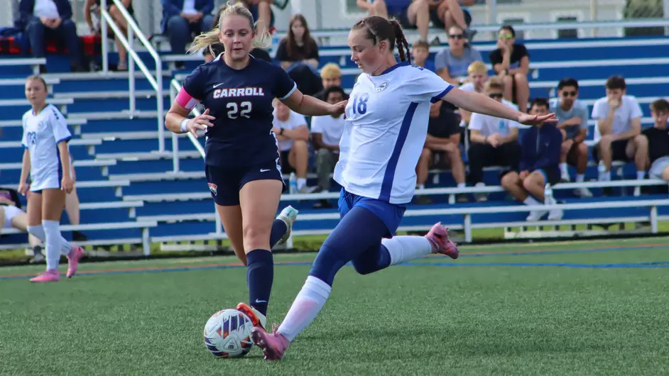 women playing college soccer