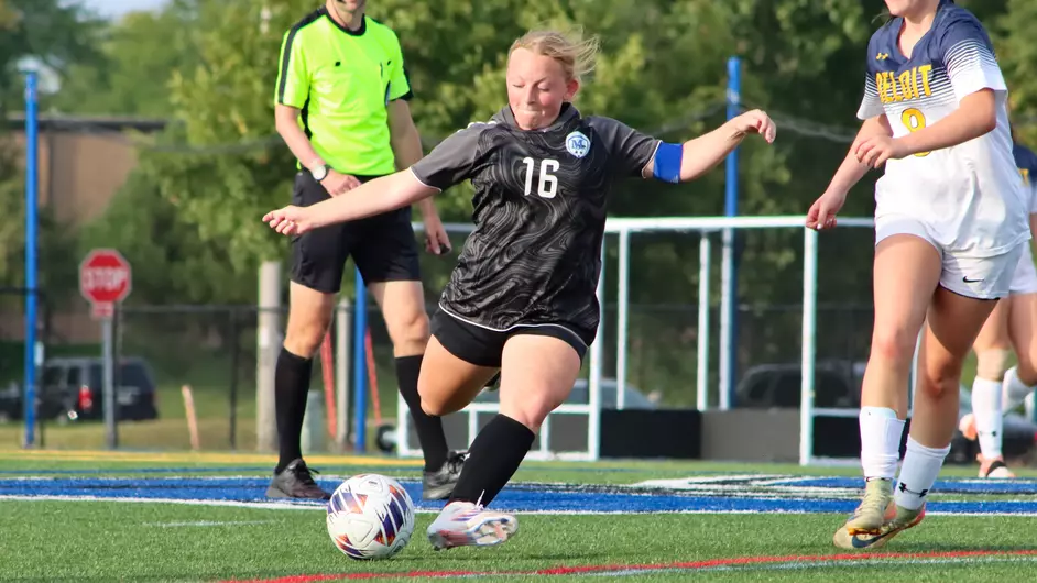 Women playing college soccer