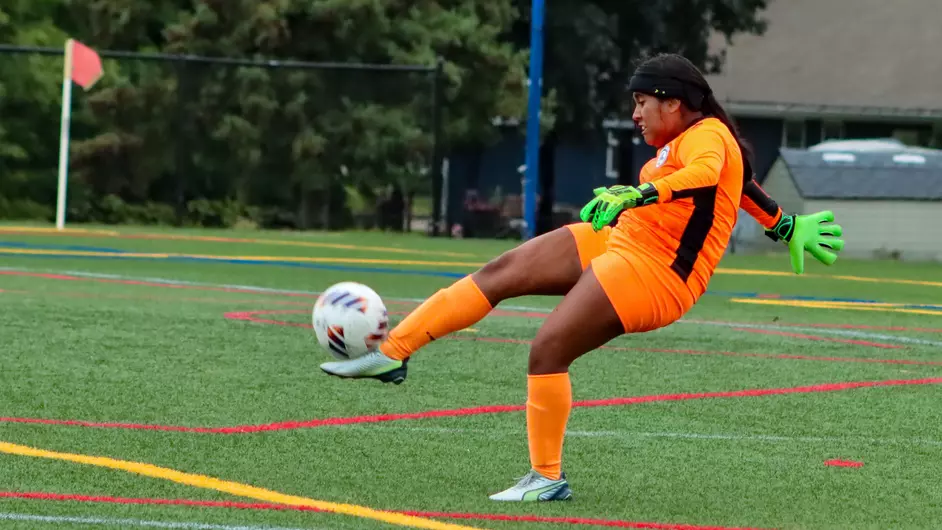Women playing college soccer