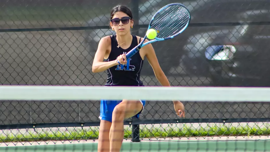 women playing college tennis