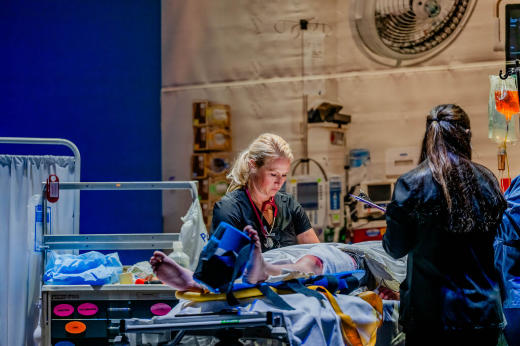 medical professionals taking care of a patient on a table