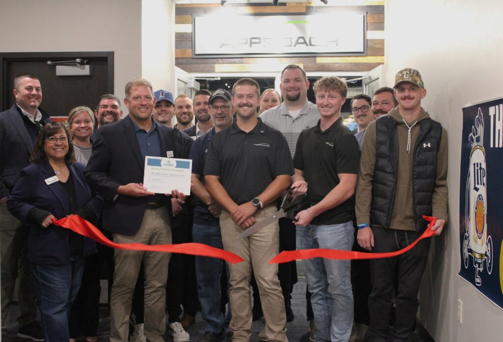 A large group inside for a ribbon cutting
