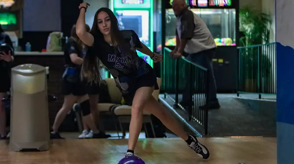 Women bowling for their college team