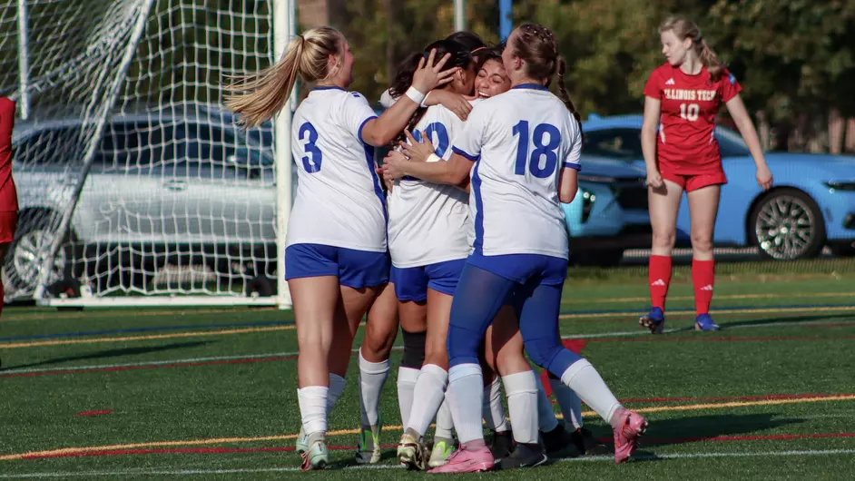 women playing college soccer