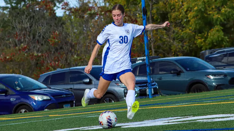 Women playing college soccer
